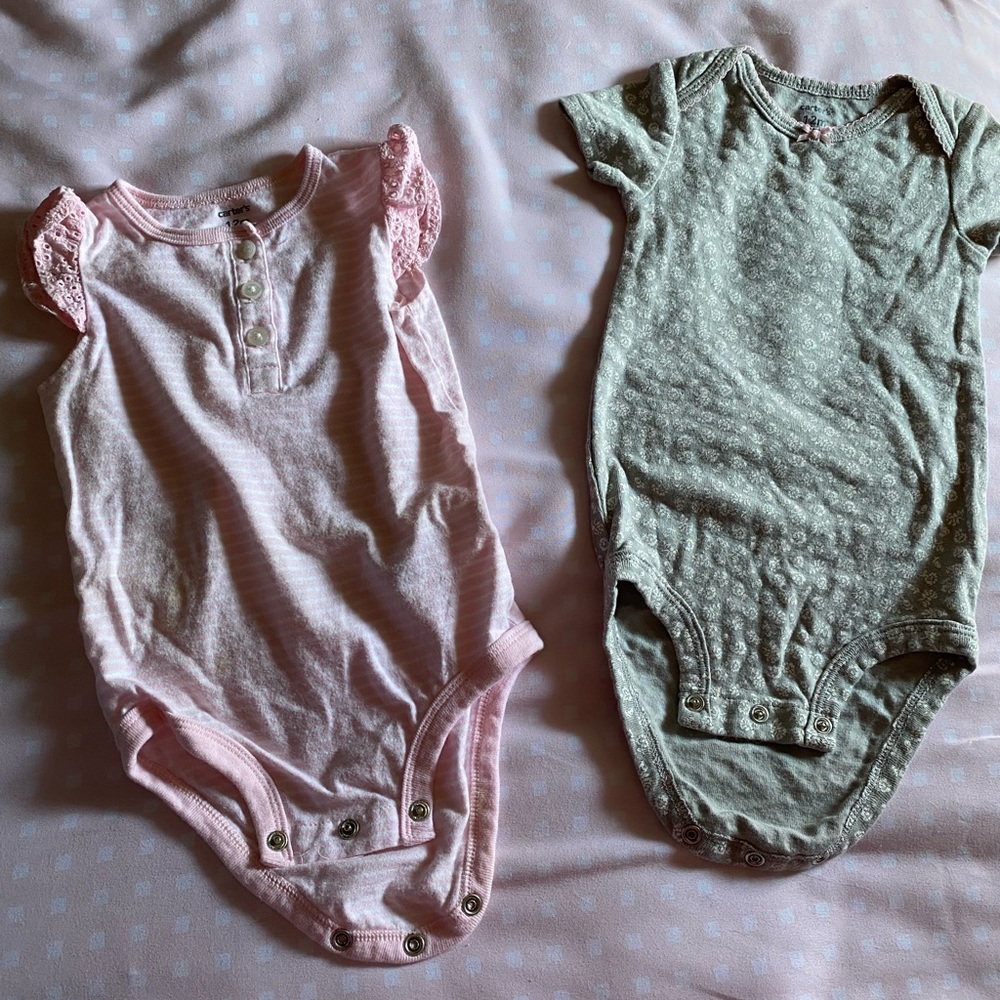 Two onsesies by Carters.